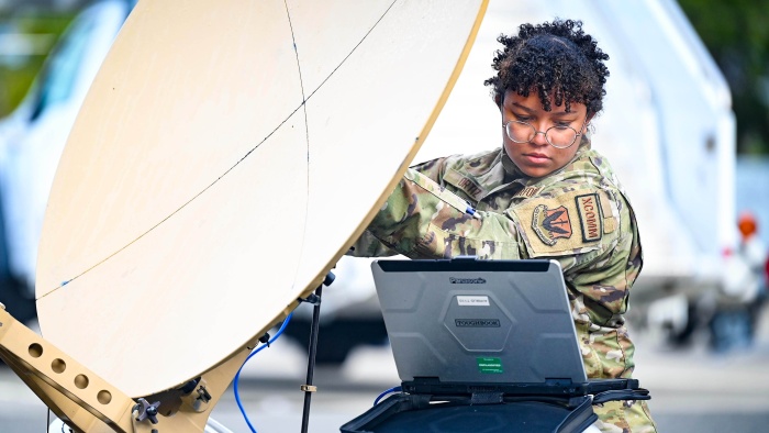 Air Force Airman 1st Class Rashin Ortiz aligns a satellite during Bamboo Eagle