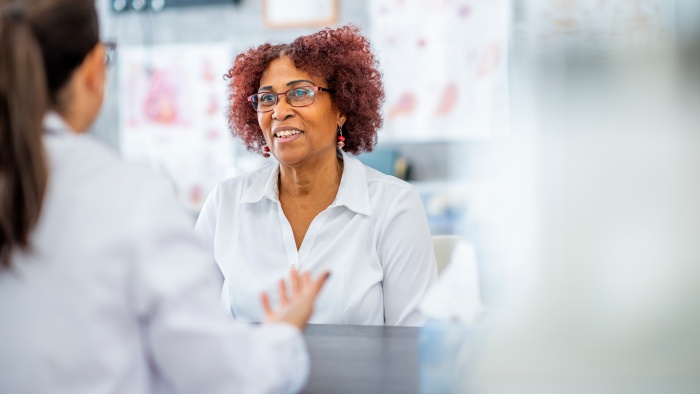 Woman speaking with a doctor