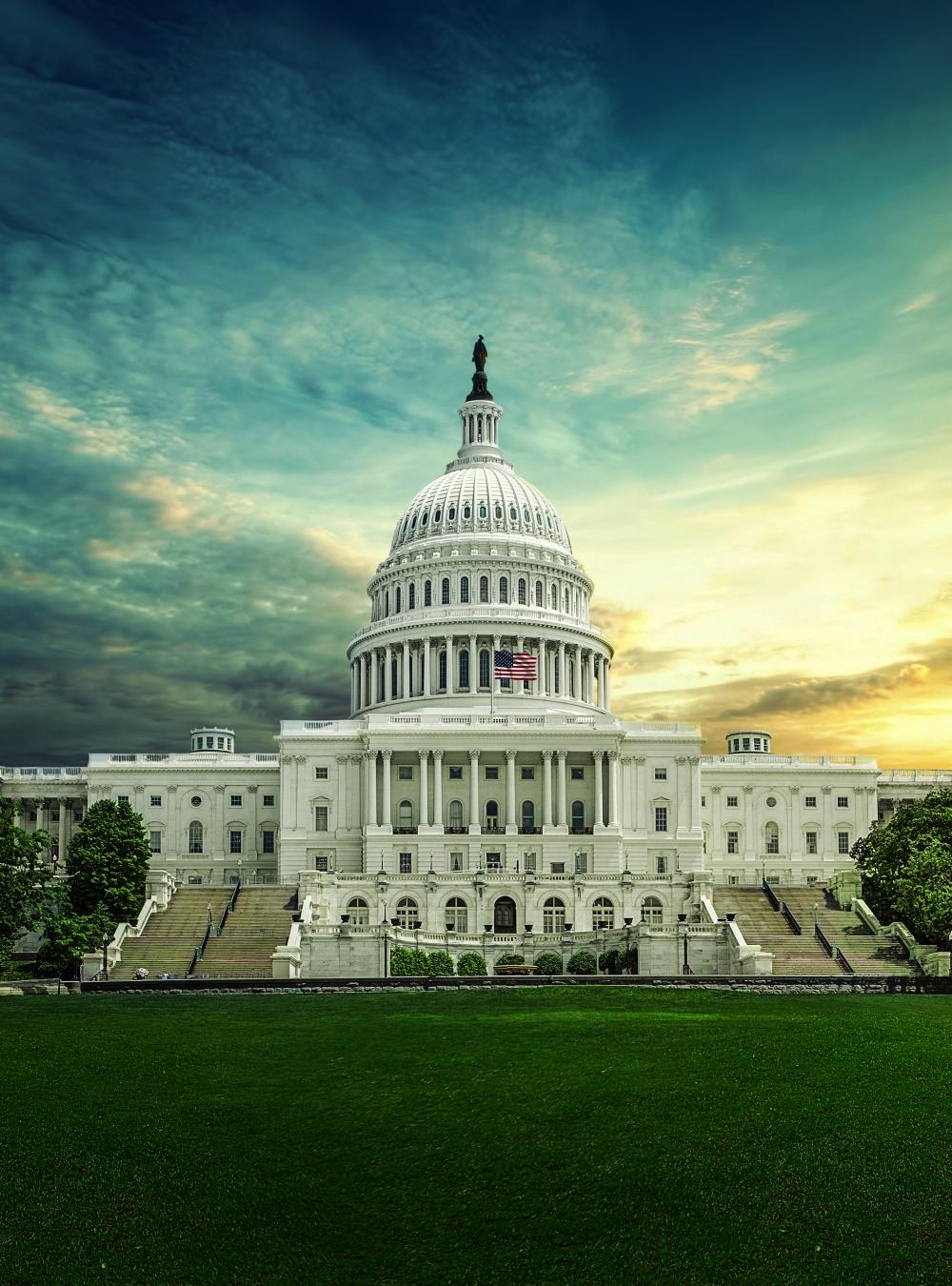 Capitol building framed by a dramatic sky