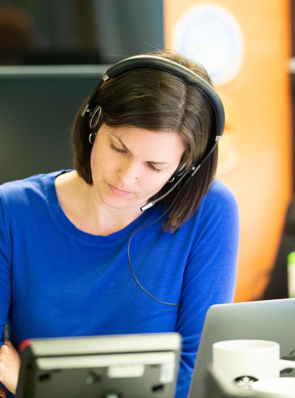 Woman working with headset on