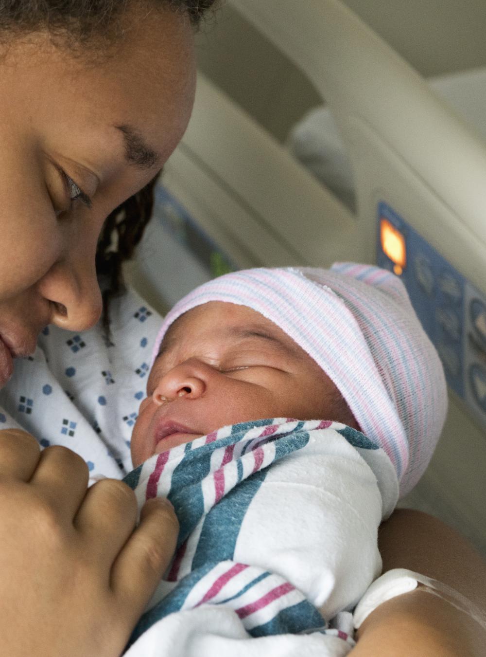 Woman holding her newborn baby