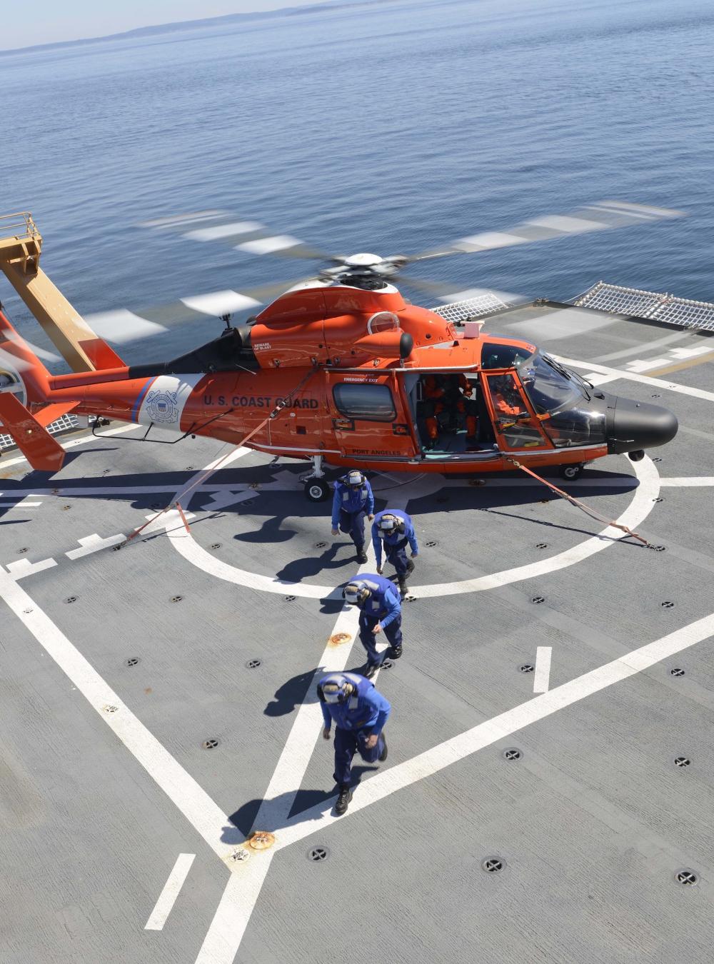 Coast Guard helicopter about to take off from a ship