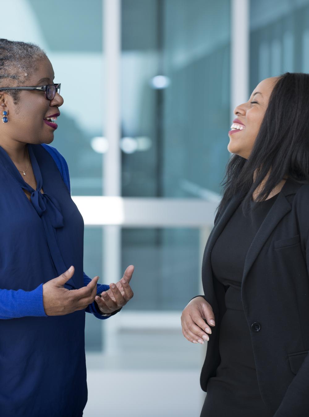 Employee council participants in a positive, animated conversation at work