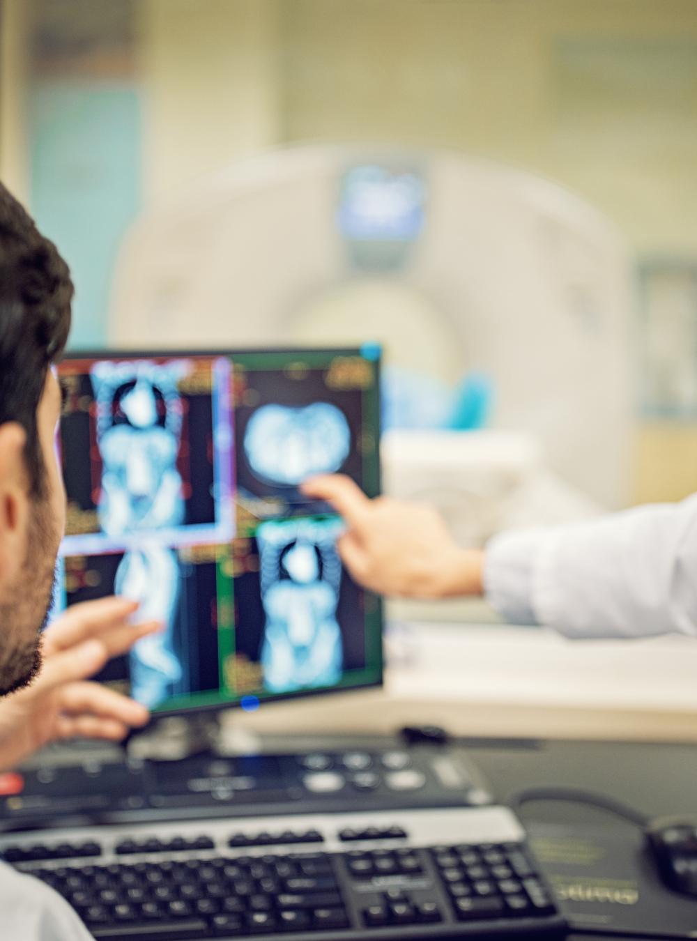 Doctors looking at medical data on a screen together