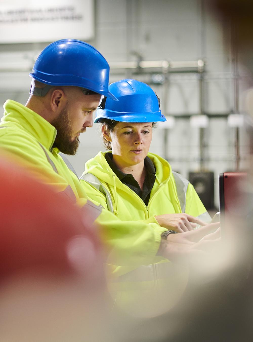 Workers in an industrial facility