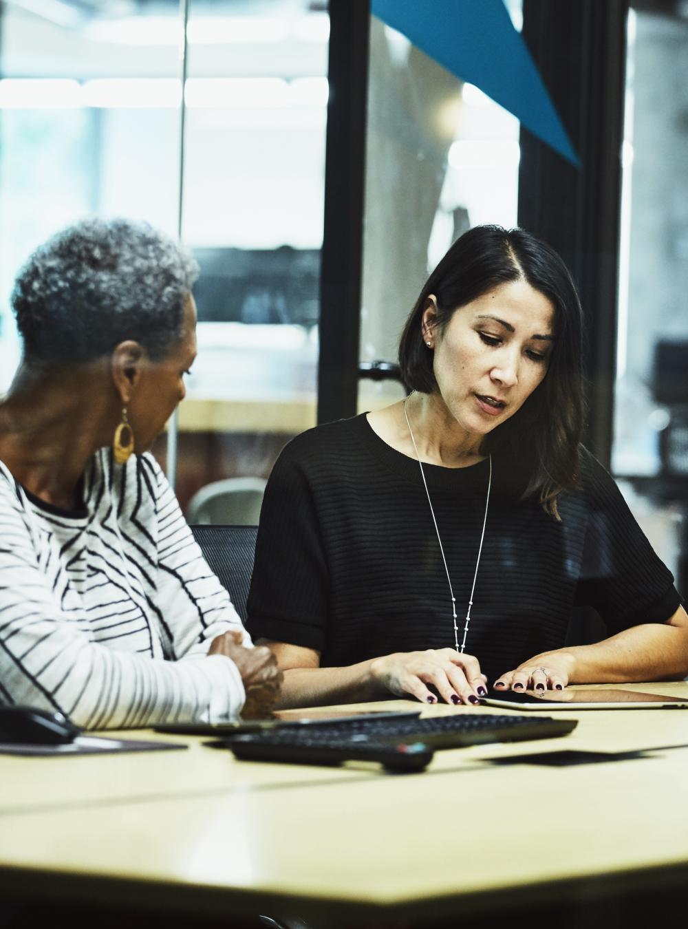 Team of women collaborating together in an office setting