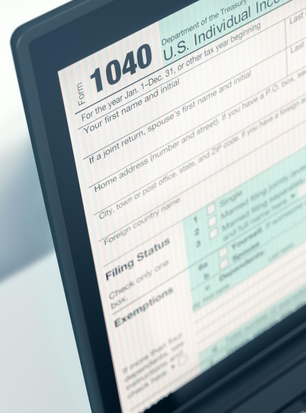 1040 tax form pulled up on a laptop