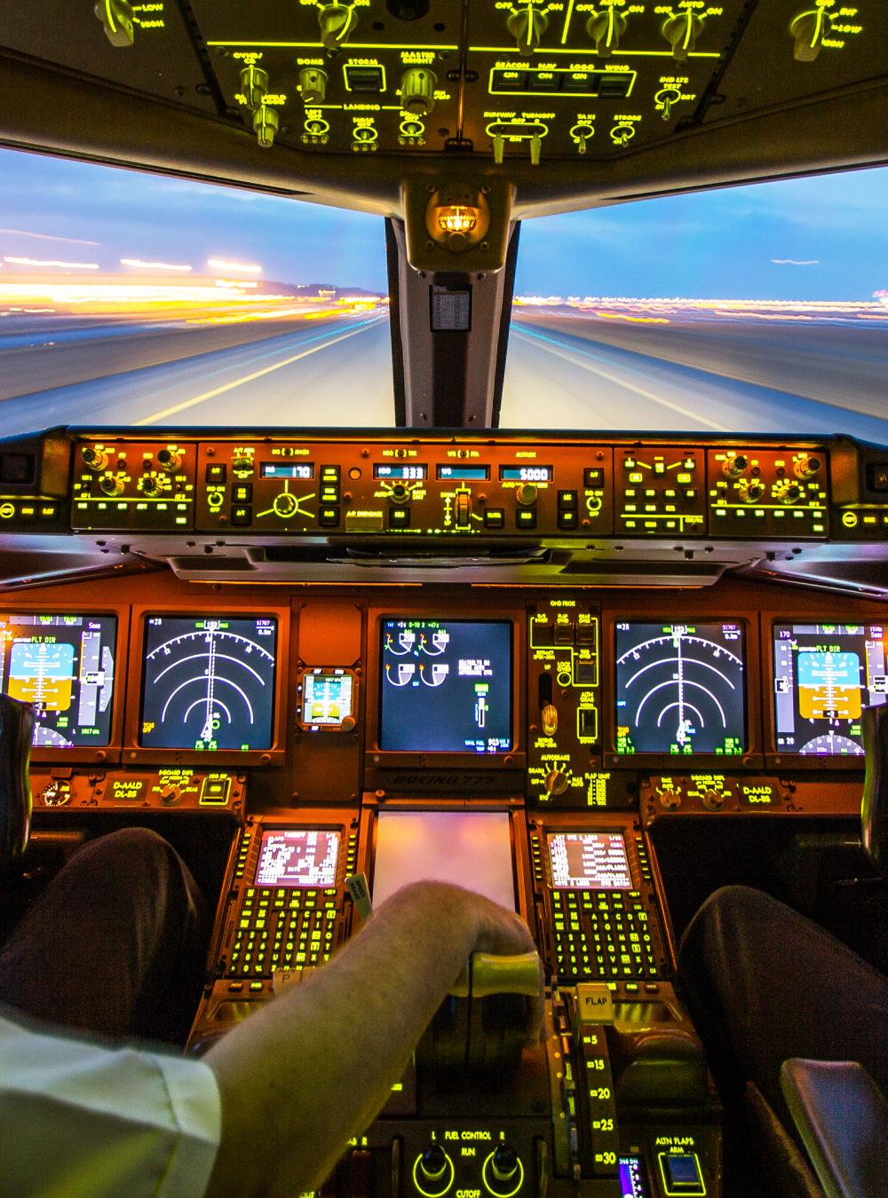 Pilots In the cockpit of plane during take-off