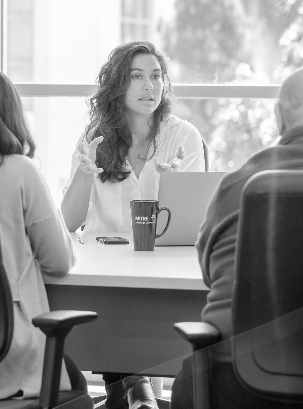 MITRE San Diego site meeting at a conference room table