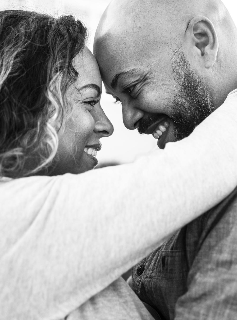 Husband and wife embracing outside