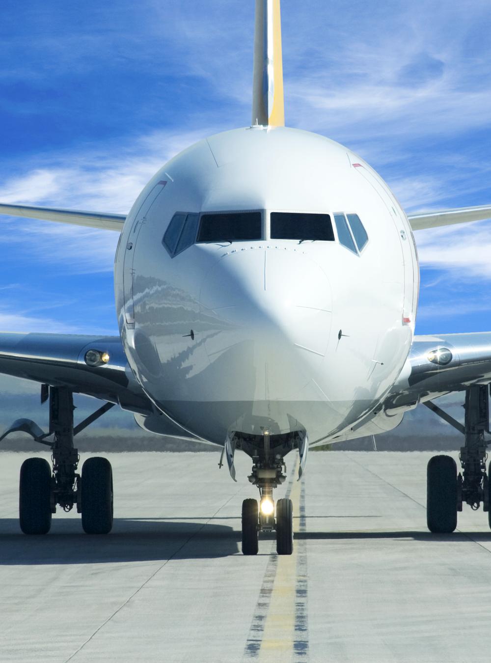 front view of commercial airline plane on runway