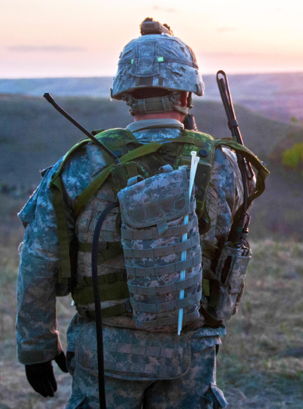 Soldier outside facing the sunset