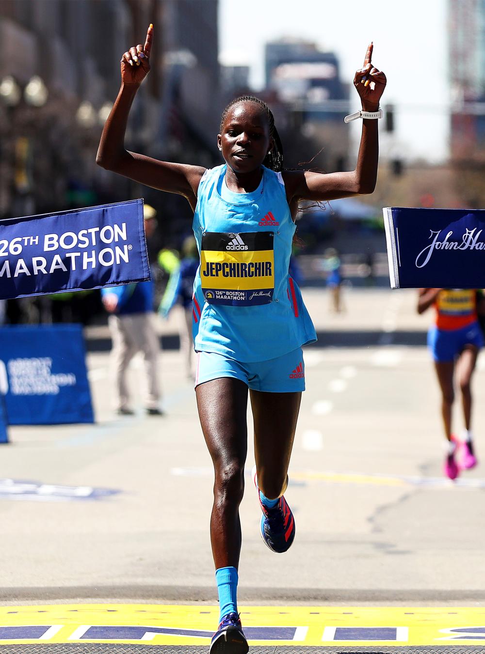 runner crossing finish line