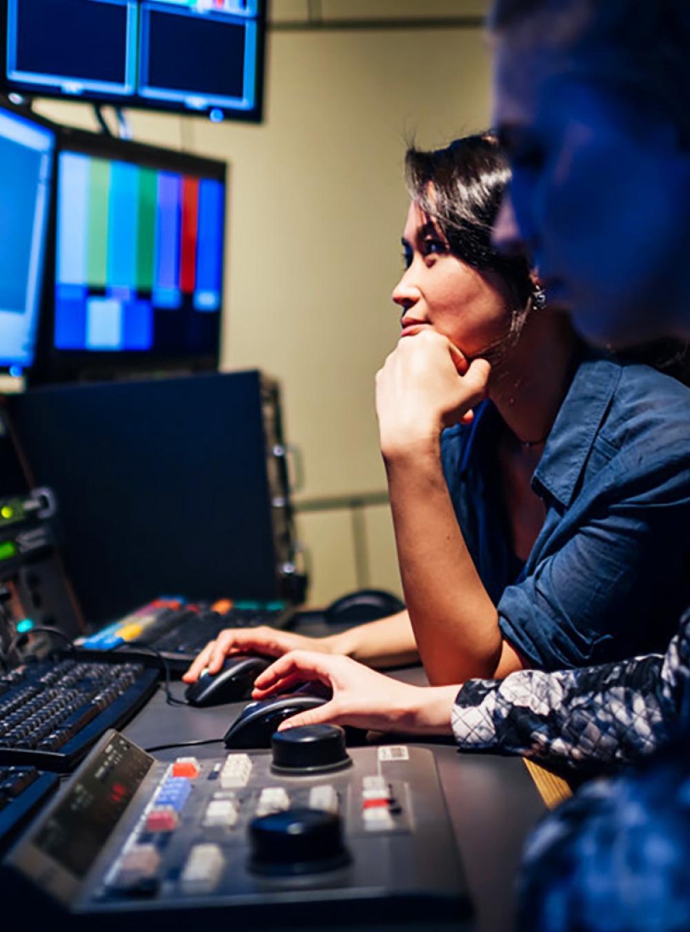 Two people working in a studio