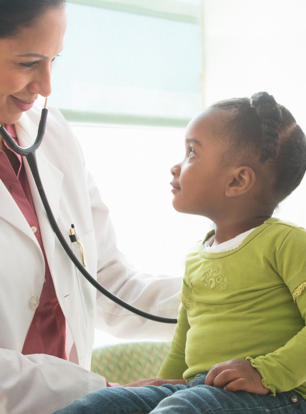 Father and daughter at with a doctor