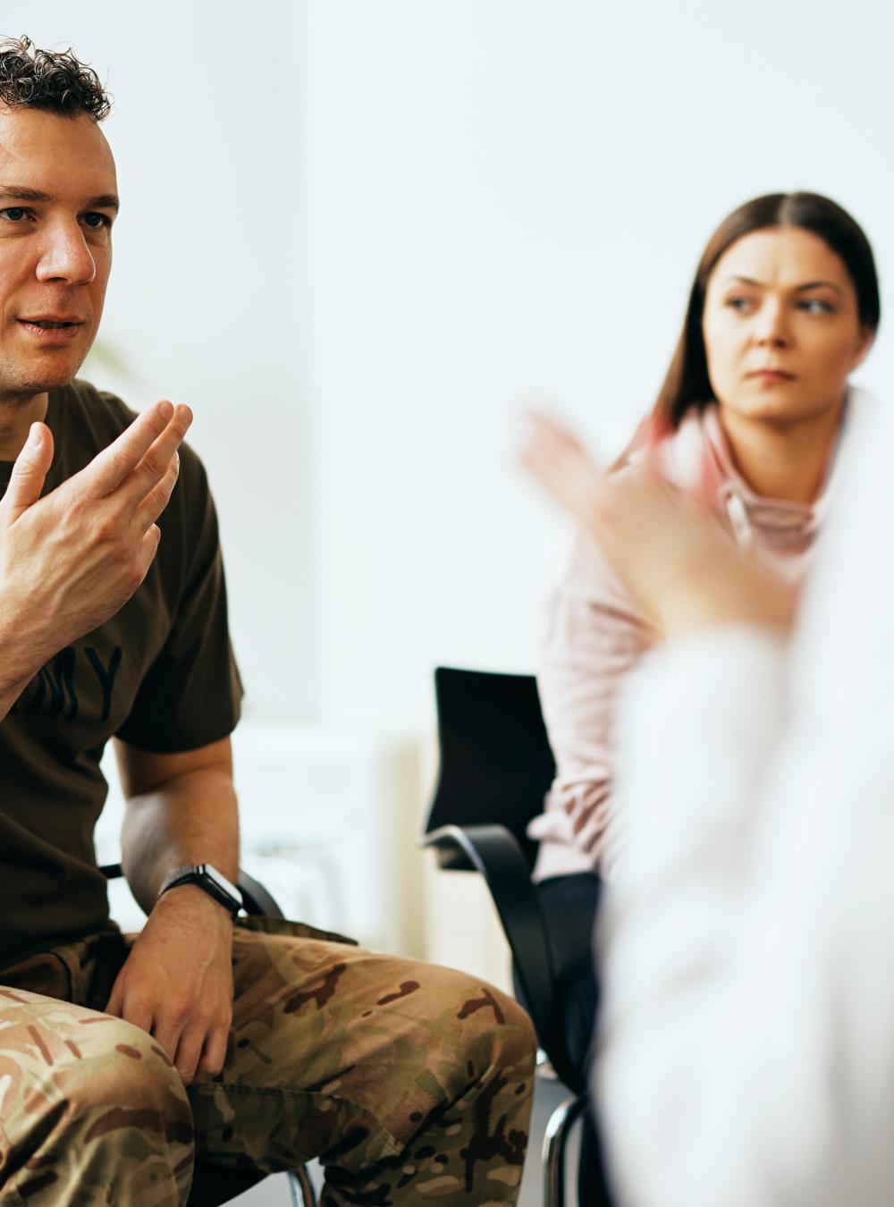 Soldier talks with counselor at military counseling center