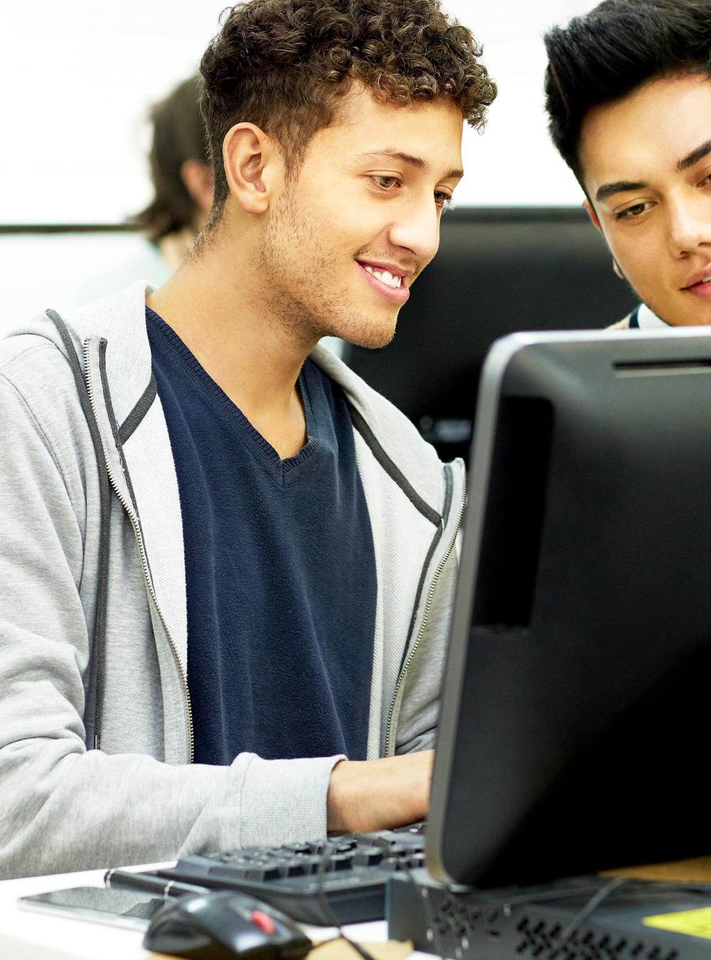 College students working together in a college computer lab