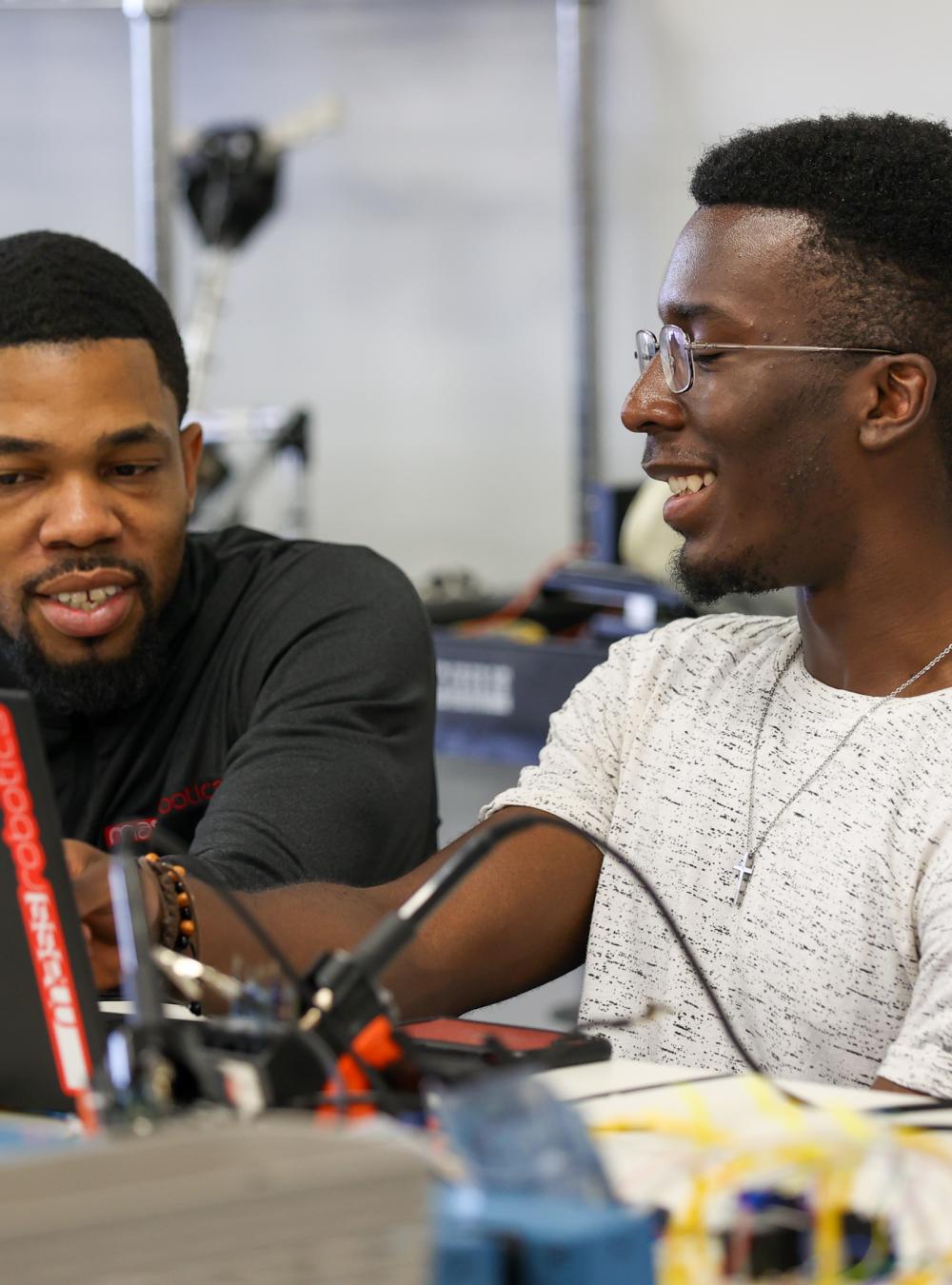 high school students in robotic lab