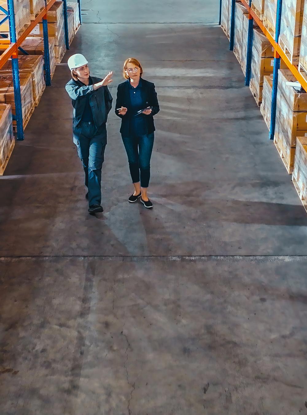 people walking in a warehouse