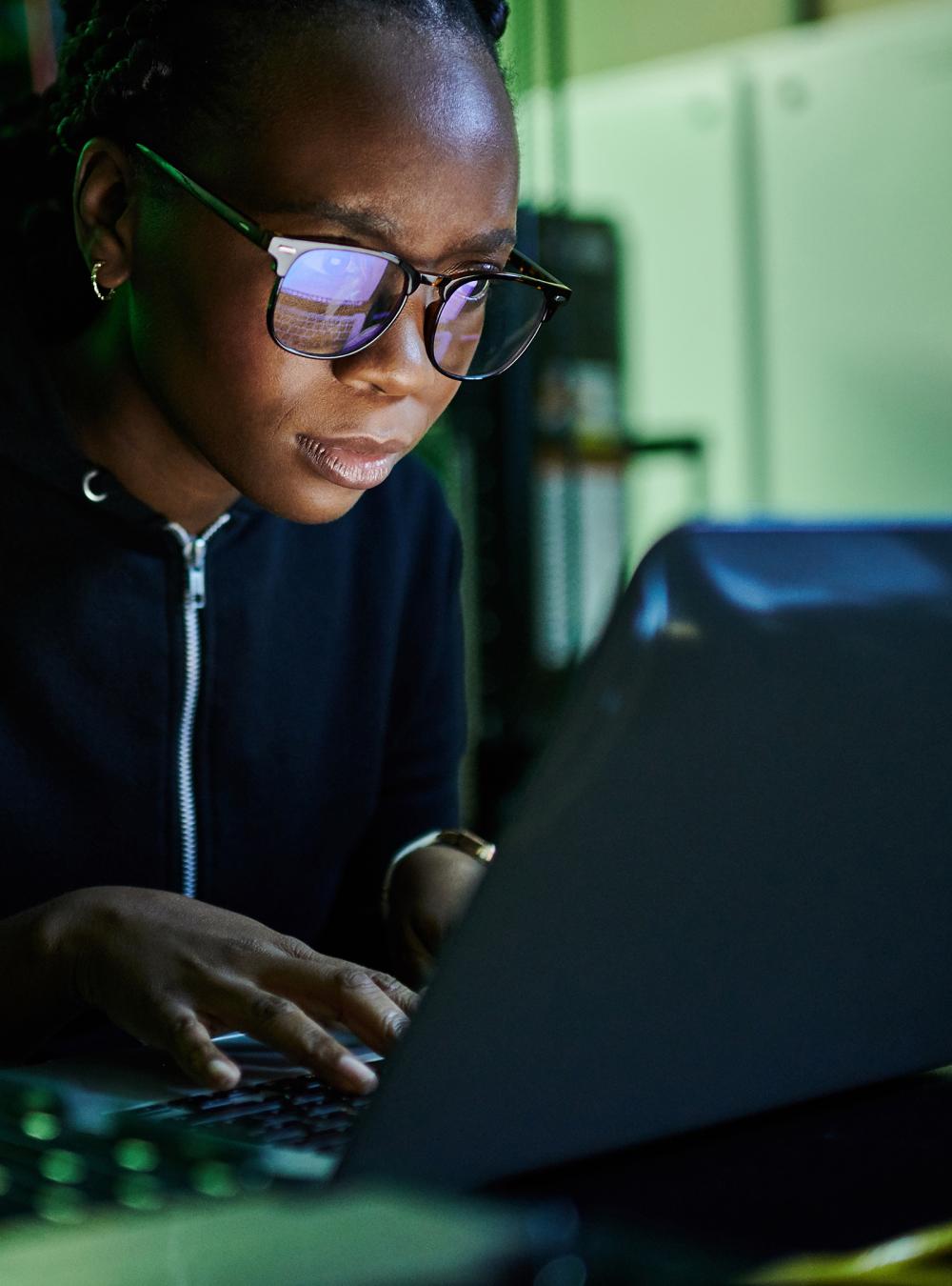 Woman typing on a laptop