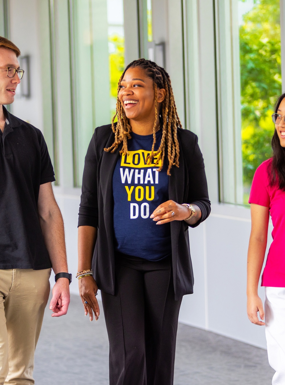 Lex walking with two interns