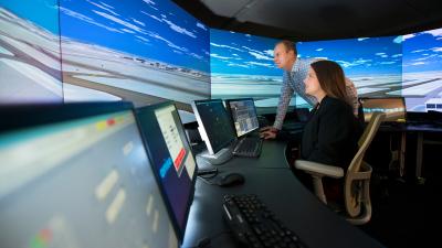 The air traffic control tower simulator in MITRE’s Integration Demonstration and Experimentation for Aeronautics Lab