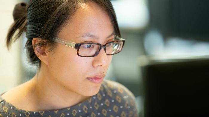 Woman working at a computer