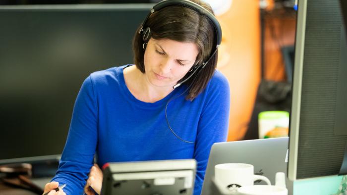 Woman working with headset on