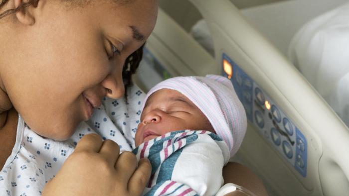 Woman holding her newborn baby