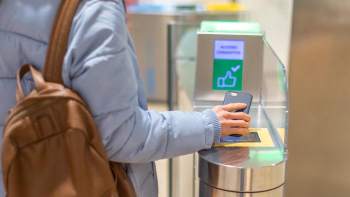 Person scanning a smartphone