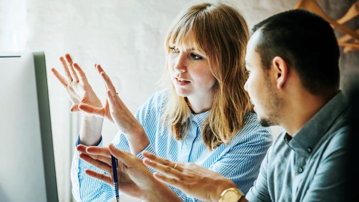 Man and woman working together to explore a tough problem