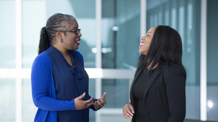 Employee council participants in a positive, animated conversation at work