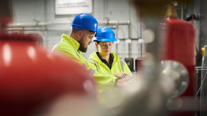 Workers in an industrial facility