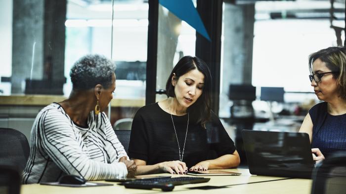 Team of women collaborating together in an office setting