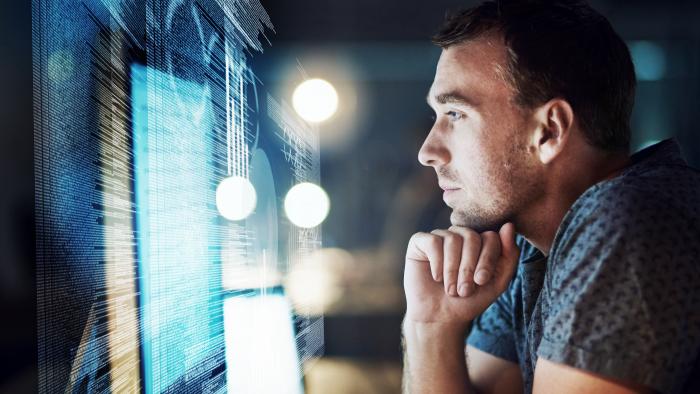 Man reviewing digital data using the cloud