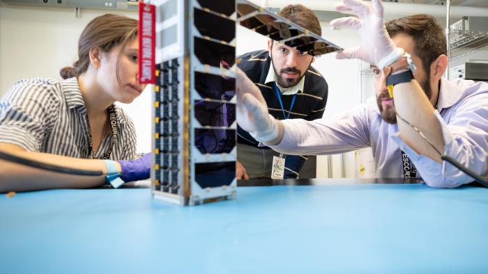 MITRE team working on a FUSE antenna, created in collaboration with the U.S. Naval Research Laboratory