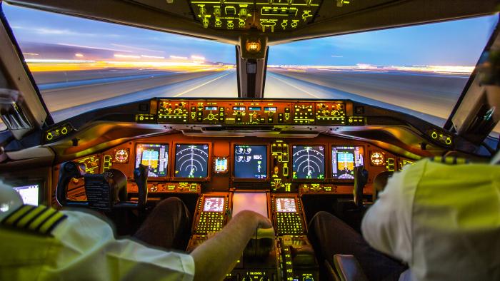 Pilots In the cockpit of plane during take-off