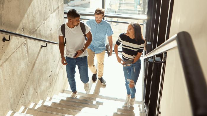 Students walking up a stairwell