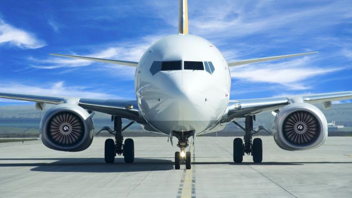 front view of commercial airline plane on runway