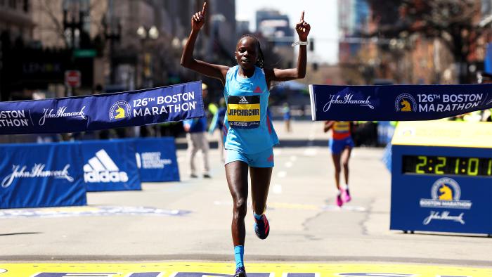 runner crossing finish line