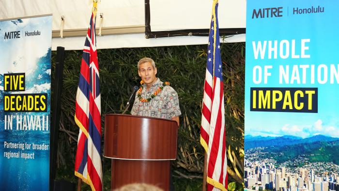 Keoki Jackson speaking at a podium