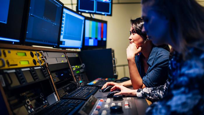 Two people working in a studio