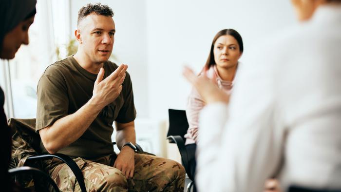 Soldier talks with counselor at military counseling center