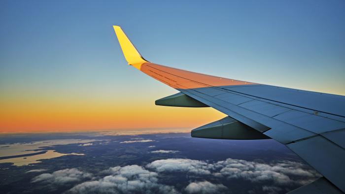 wing of a jet at sunset