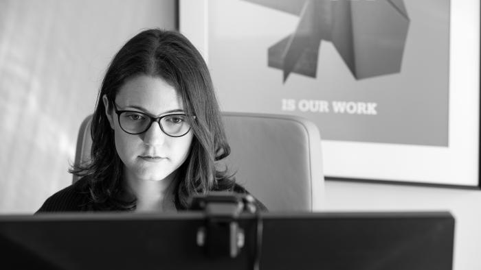 Elizabeth Karpinski working at her desk