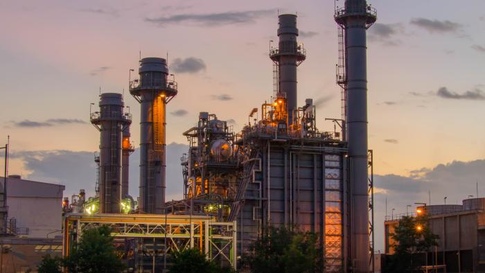 natural gas refinery at sunset