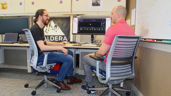 two engineers in front of computer