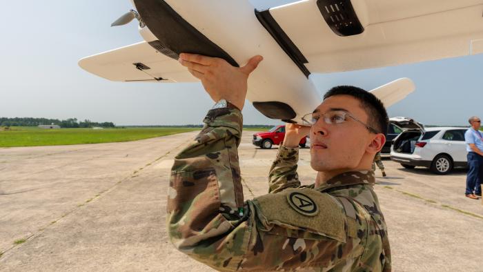 Soldier holding a drone