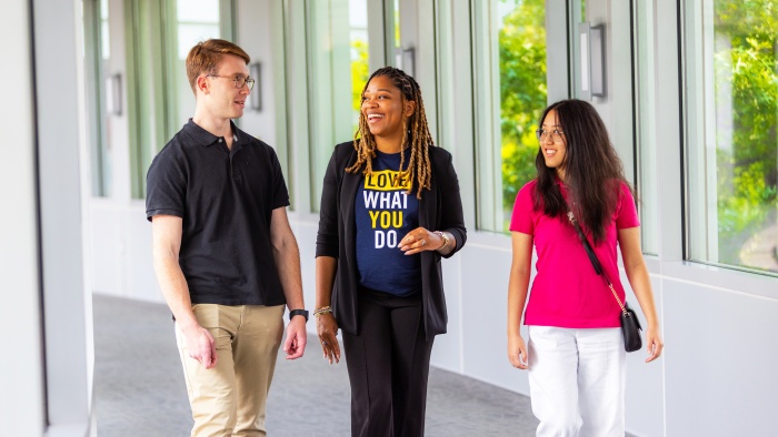 Lex walking with two interns