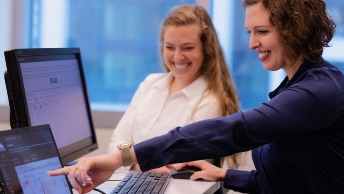 Two women collaborating at a computer